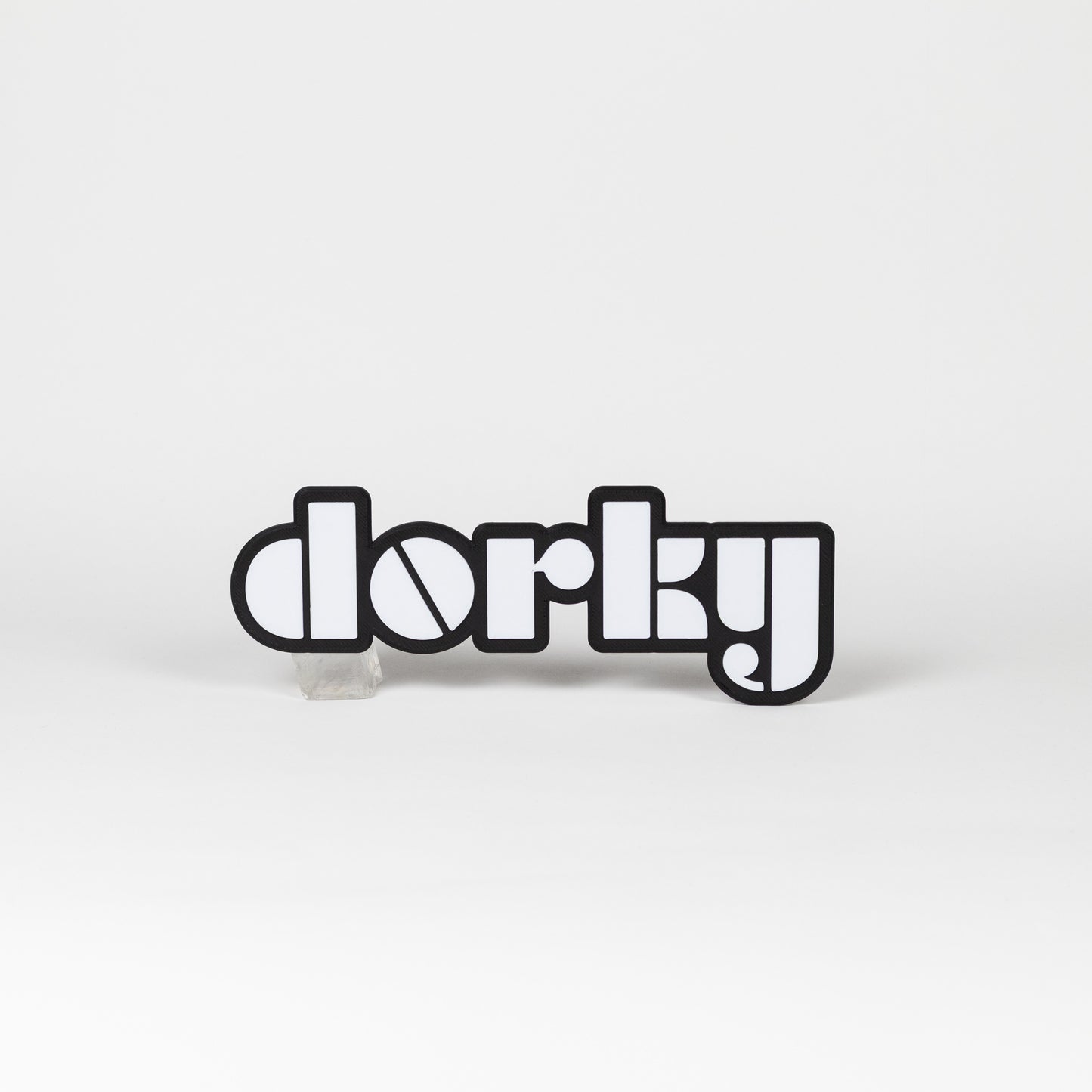 Photo booth prop sign. Black and white 'dorky' word art on a white background.