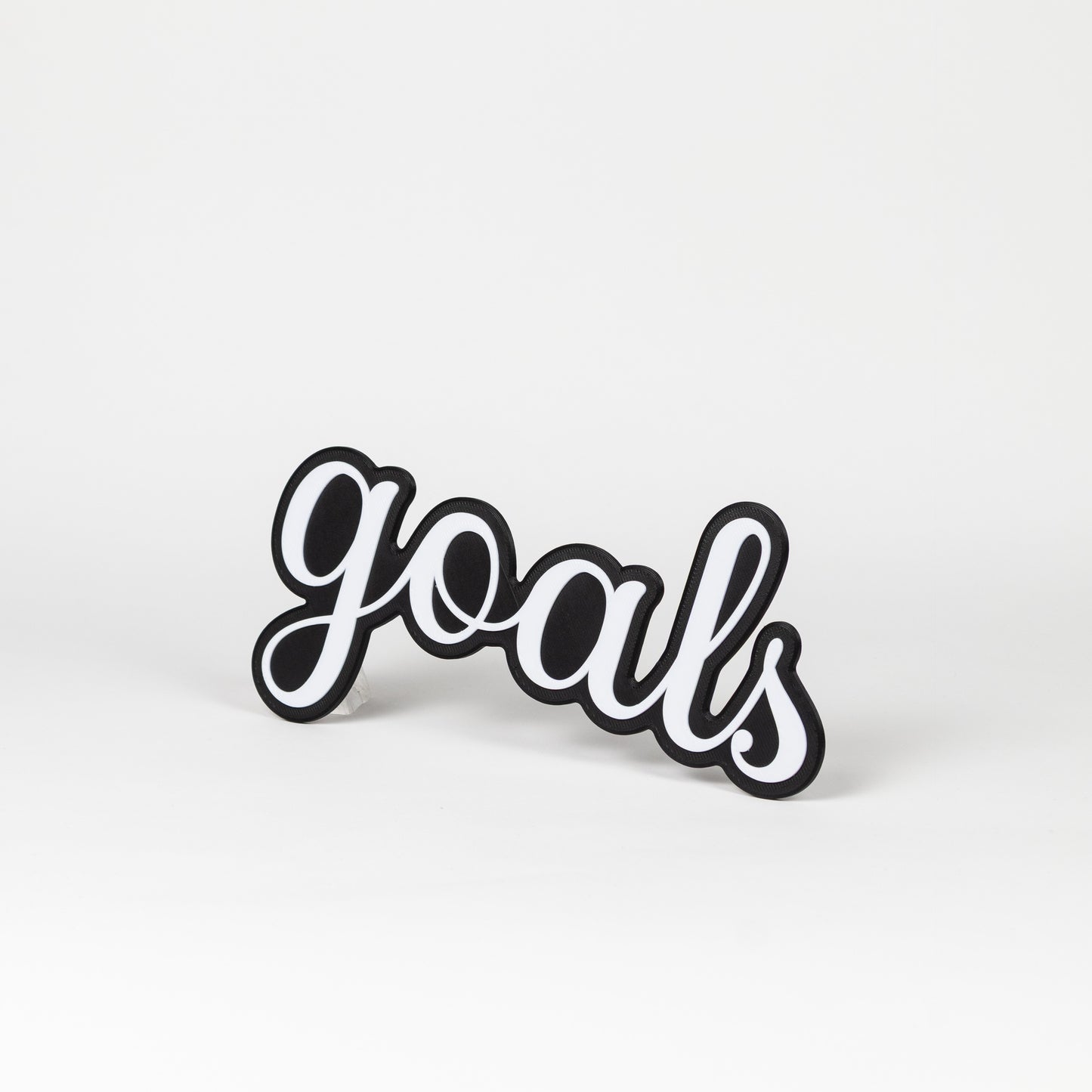 Black and white 'goals' sign on a white background