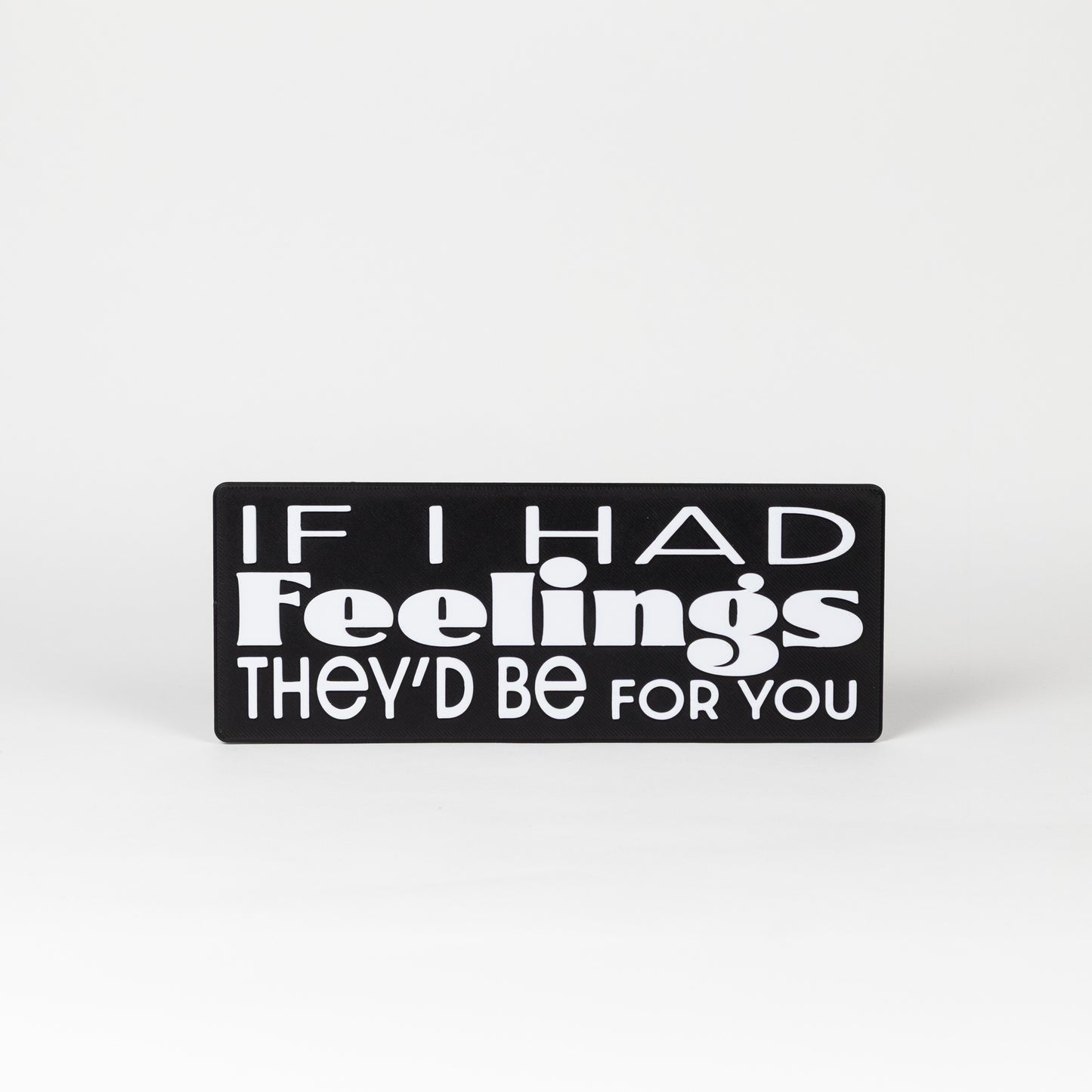 Sarcastic Photo Prop. Black sign with white text on a white background that says, "If I had feelings, they'd be for you"