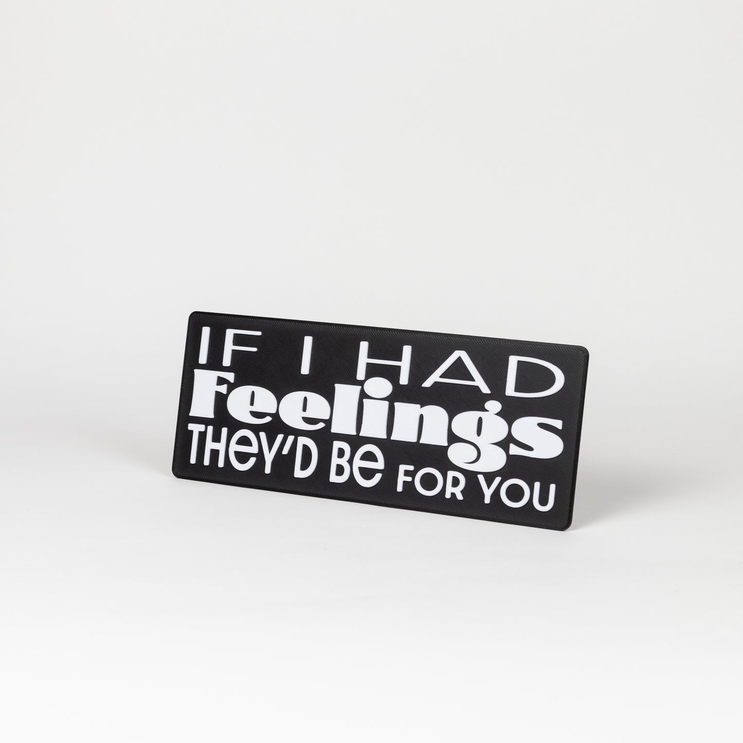Sarcastic Photo Prop. Black sign with white text on a white background that says, "If I had feelings, they'd be for you"