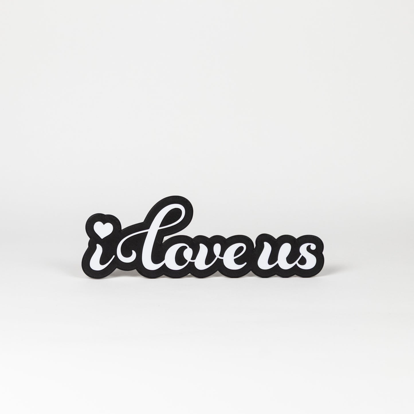 Photo Booth sign with 'i love us' text on a white background