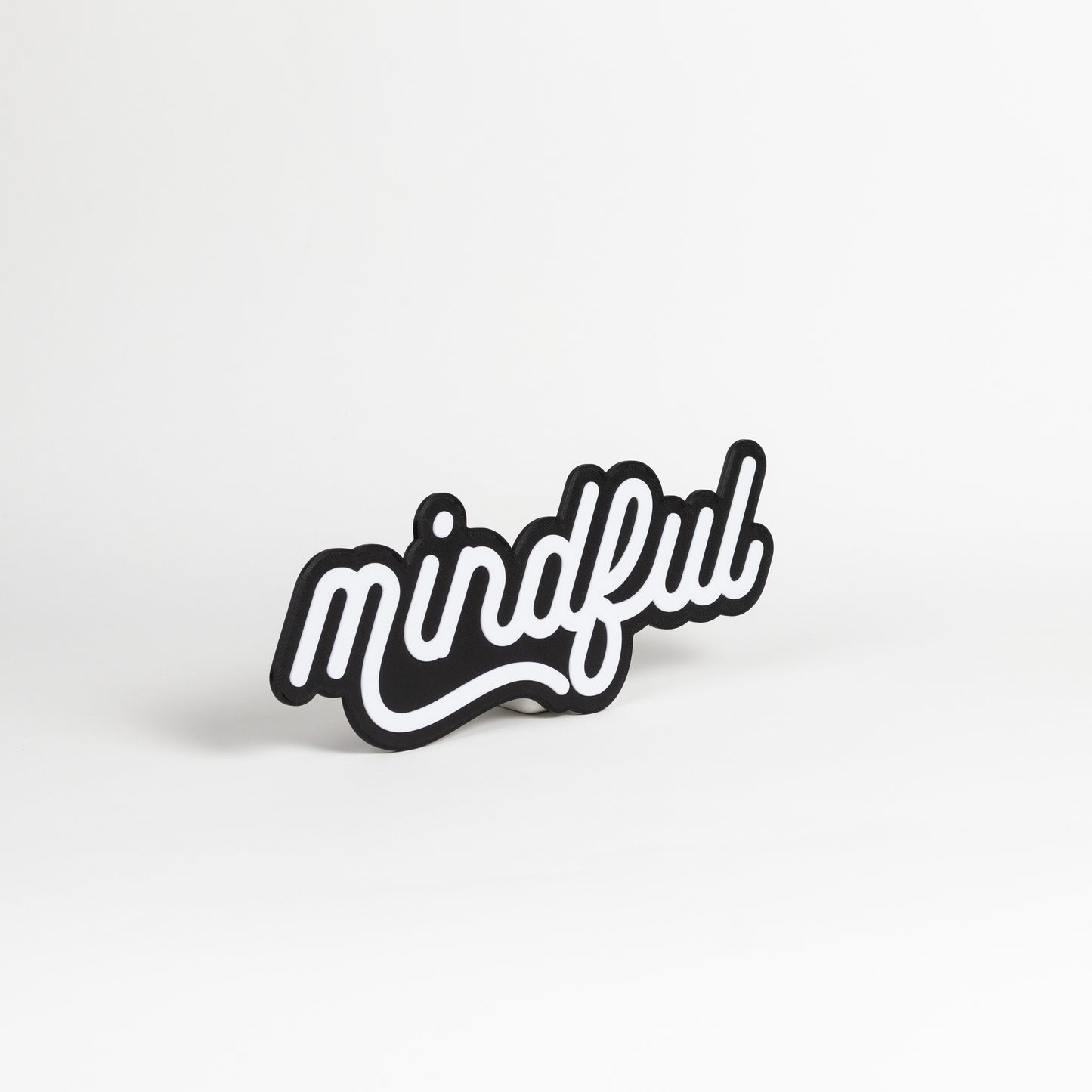 Black and white 'mindful' photo booth prop on a white background