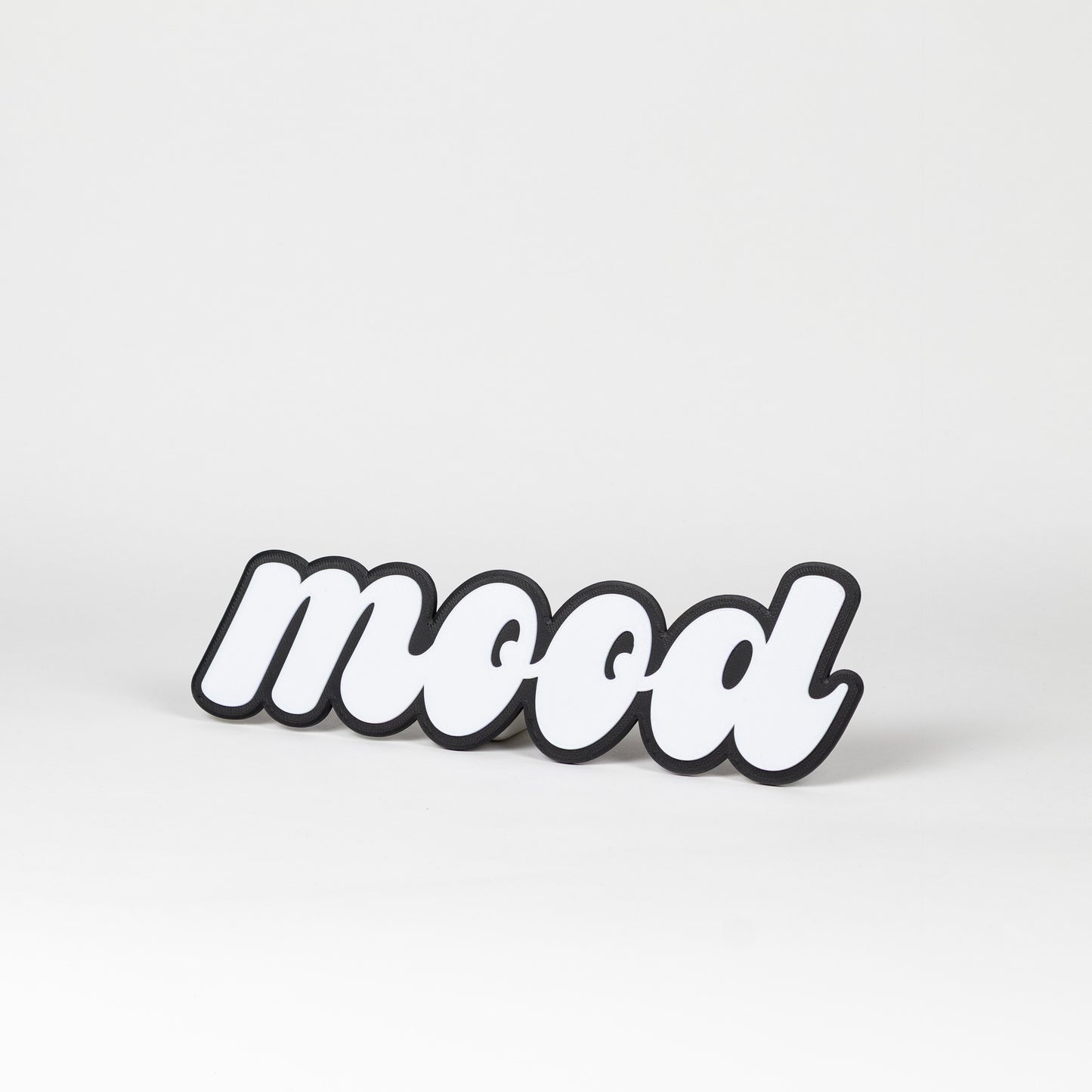 Black and white photo booth prop sign that says 'mood'. Shot on a white background
