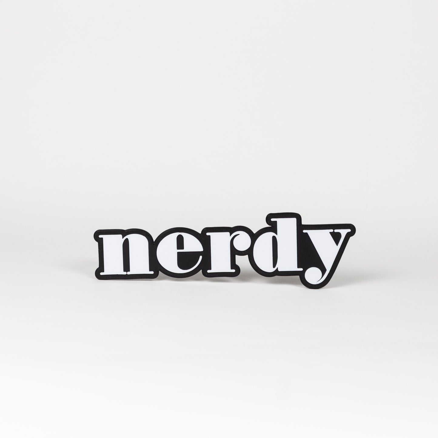 Black and white photo booth prop of the word 'nerdy'
