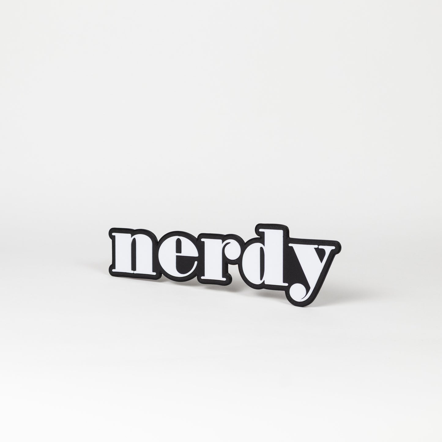 Black and white photo booth prop of the word 'nerdy'