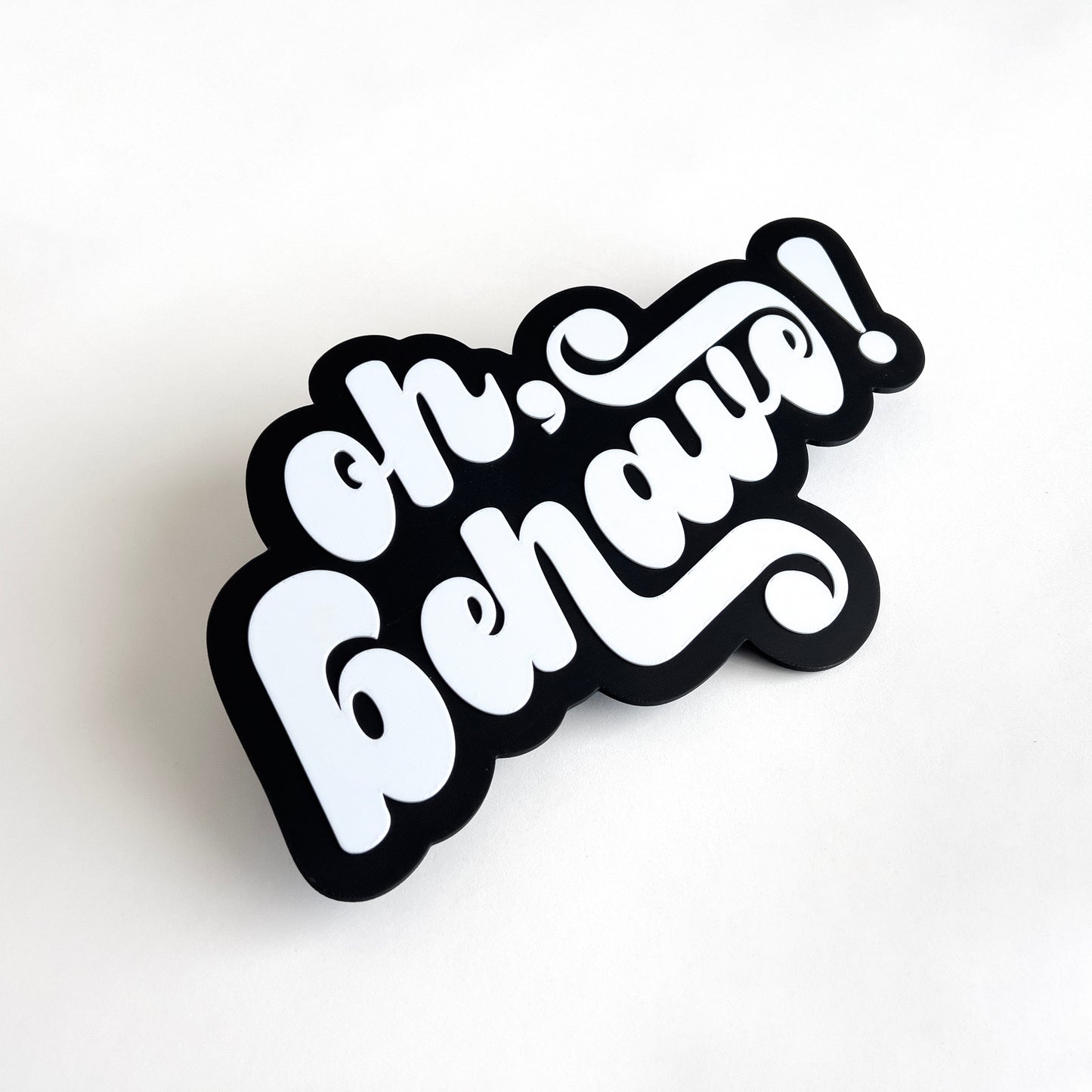 Black and white photo booth prop sign that says "oh, behave!".
