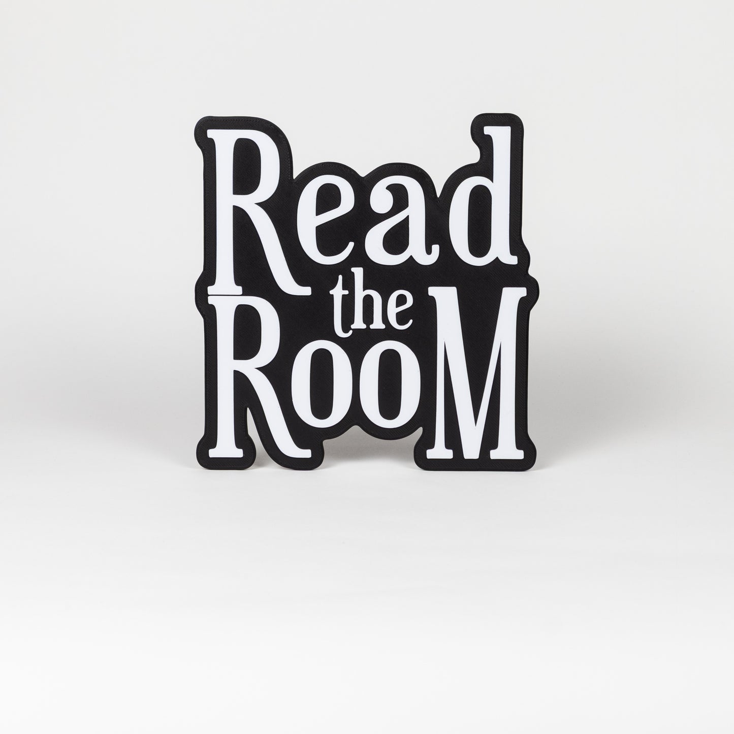 Black and white "Read the Room" sign. Photo booth prop.