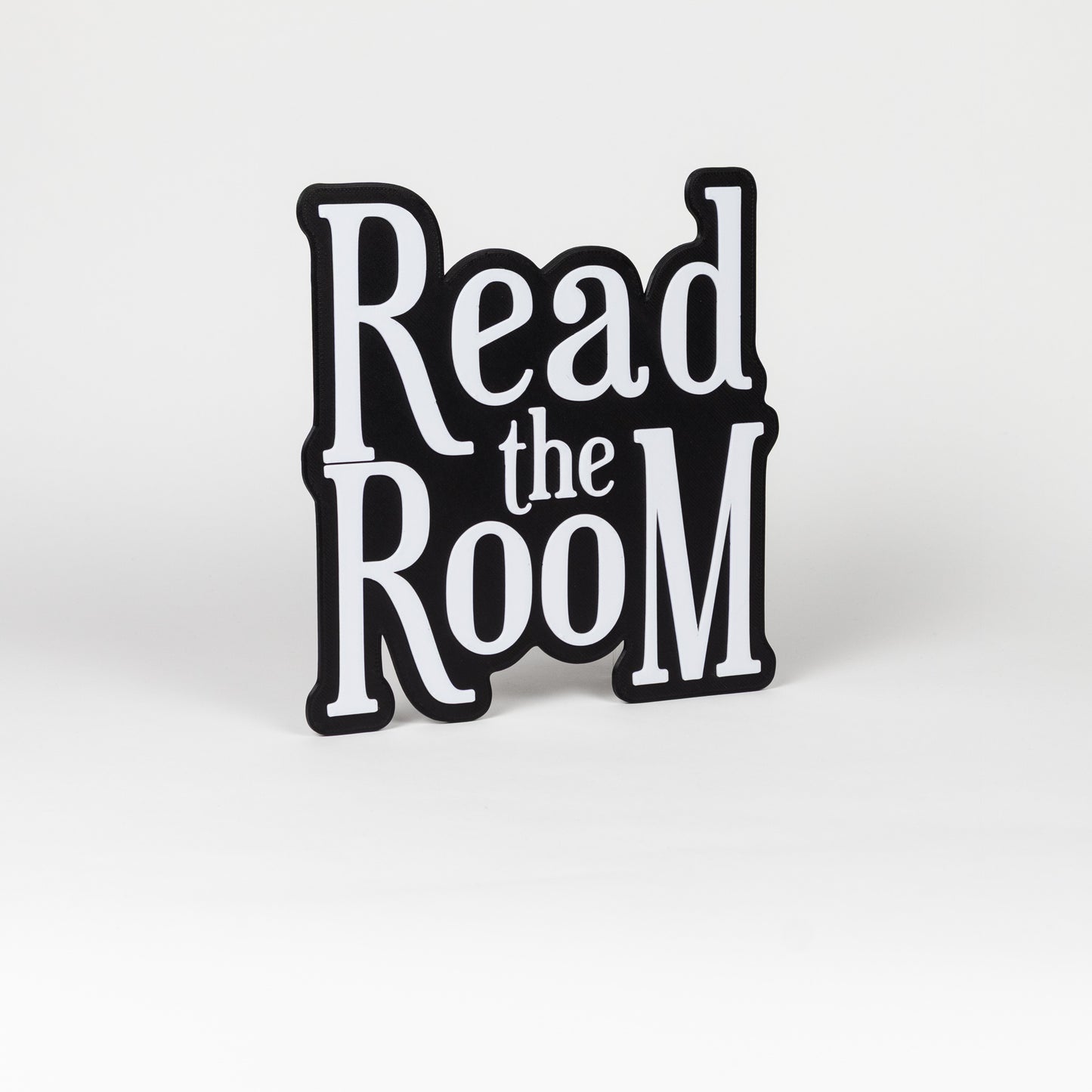 Black and white "Read the Room" sign. Photo booth prop.