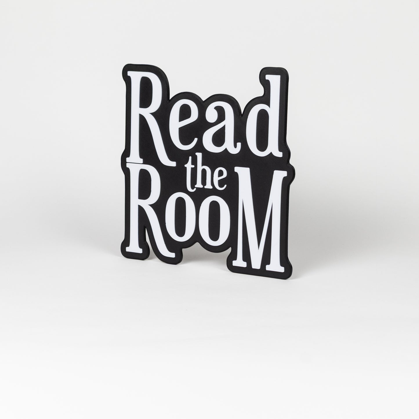 Black and white "Read the Room" sign. Photo booth prop.