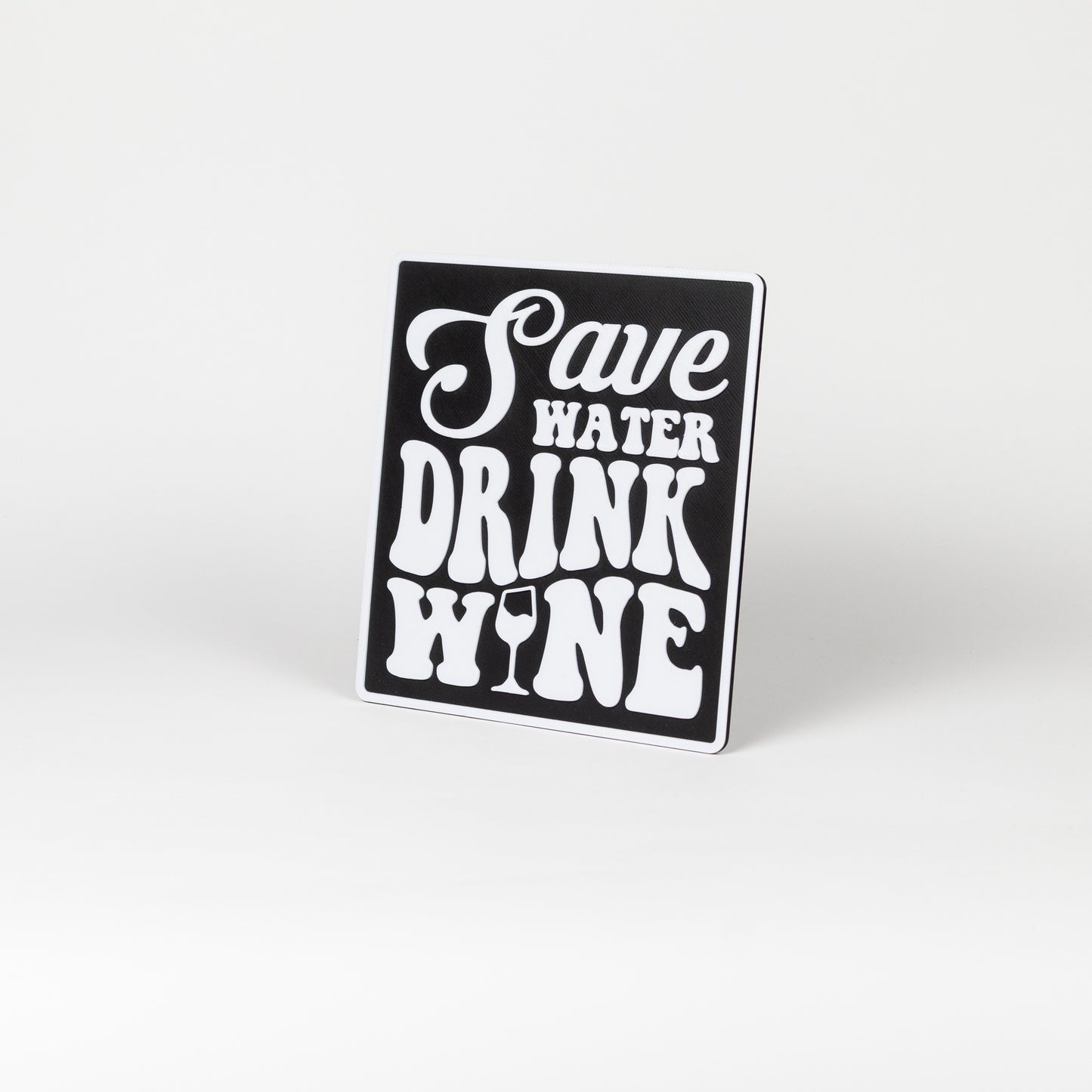 Black and white sign that says, "Save Water, Drink Wine". Photo booth prop.