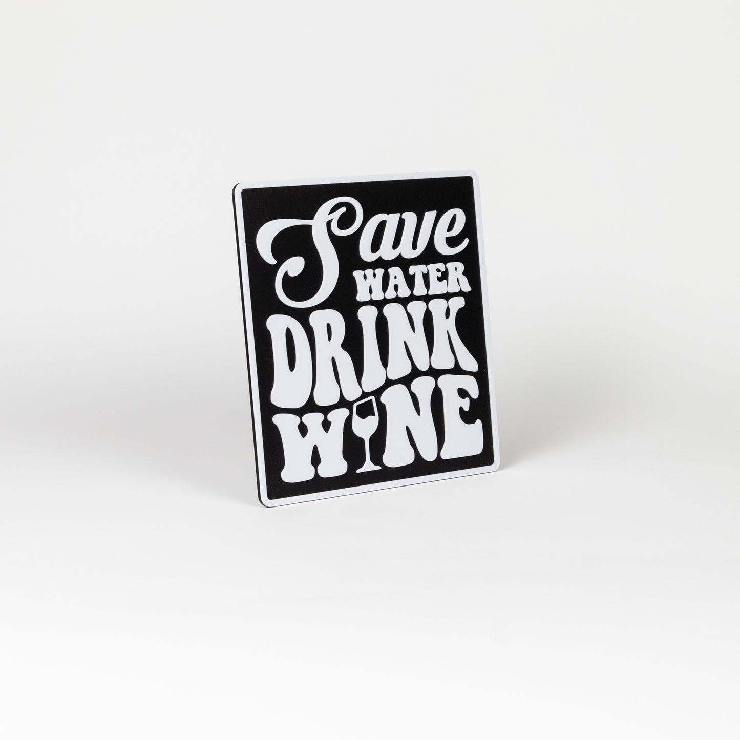 Black and white sign that says, "Save Water, Drink Wine". Photo booth prop.
