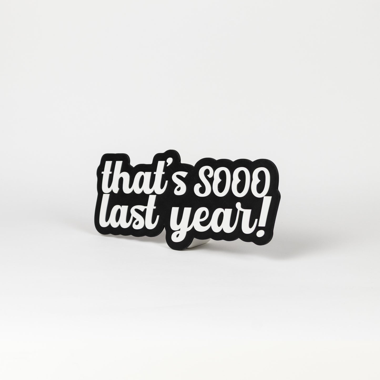 Black and white sign that says, "That's Sooo Last Year!". NYE photo party prop.