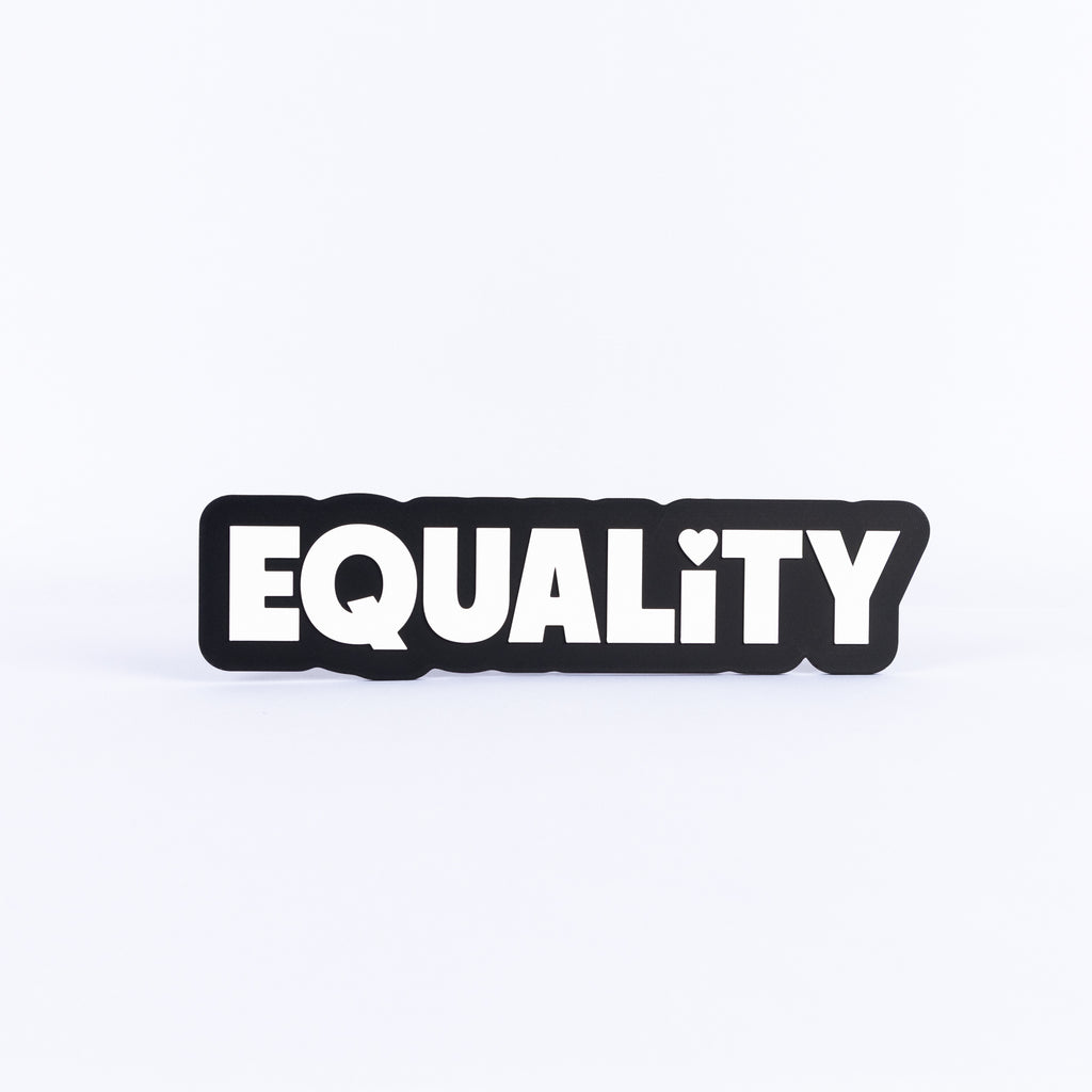 Black and white sign with the word 'EQUALITY' on a white background