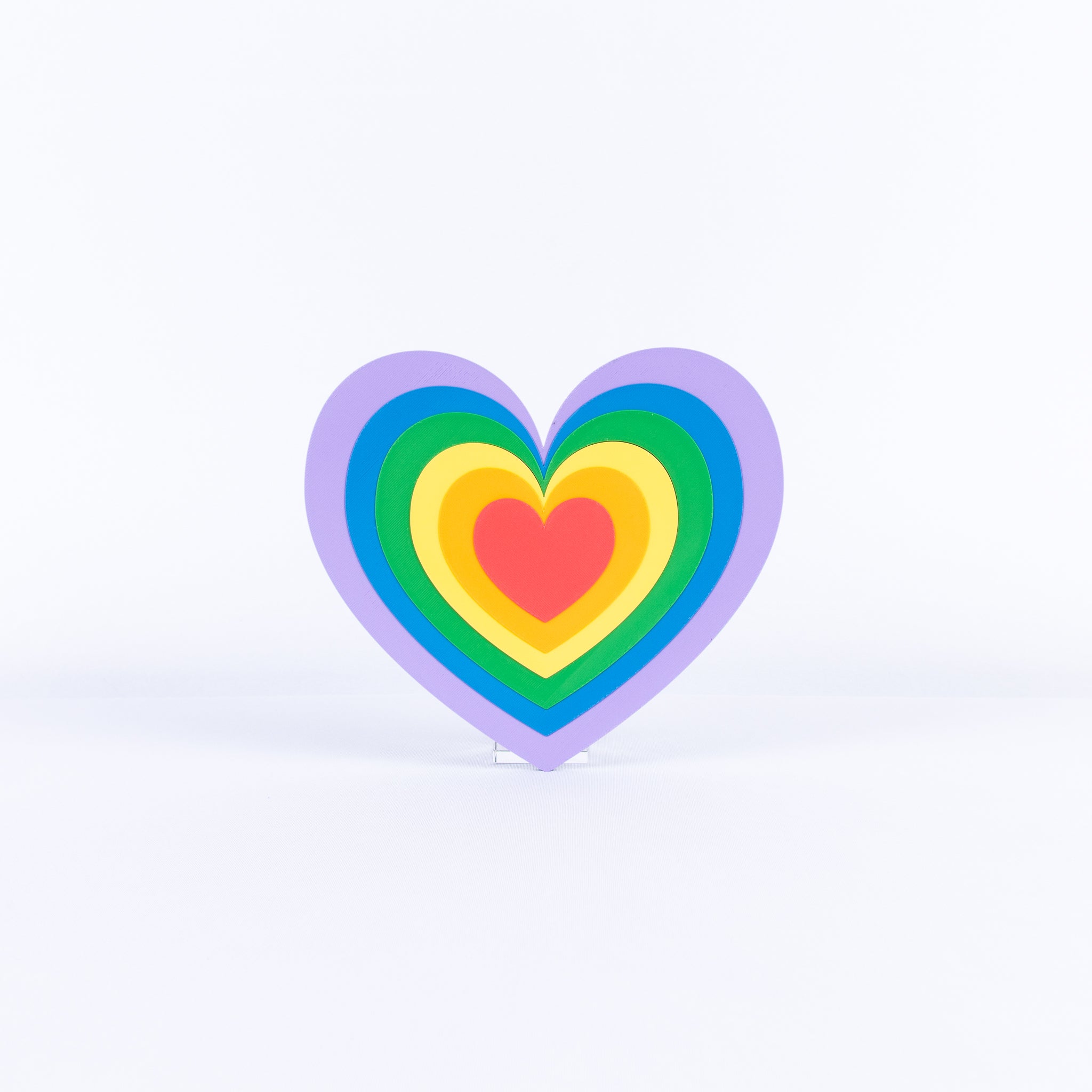 Colorful heart-shaped sign on a white background