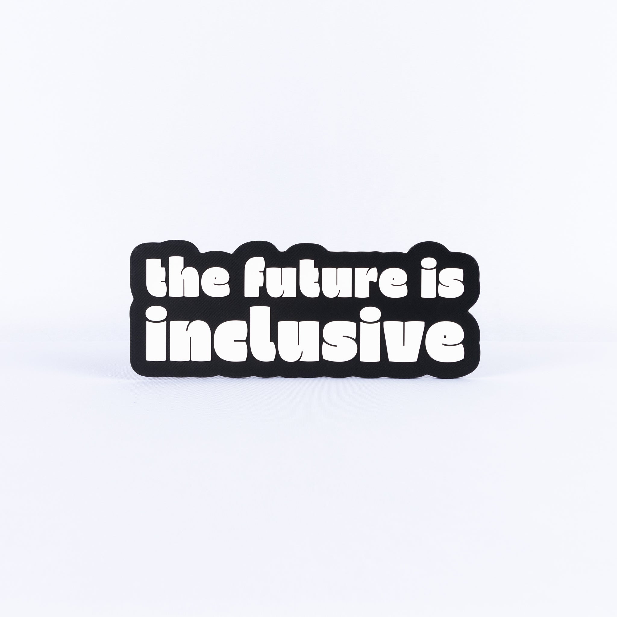 Black and white sign with 'the future is inclusive' text on a white background