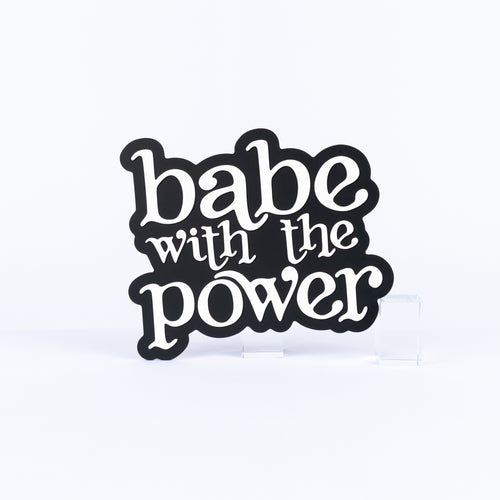 Black and white photo booth prop sign that says "babe with the power"