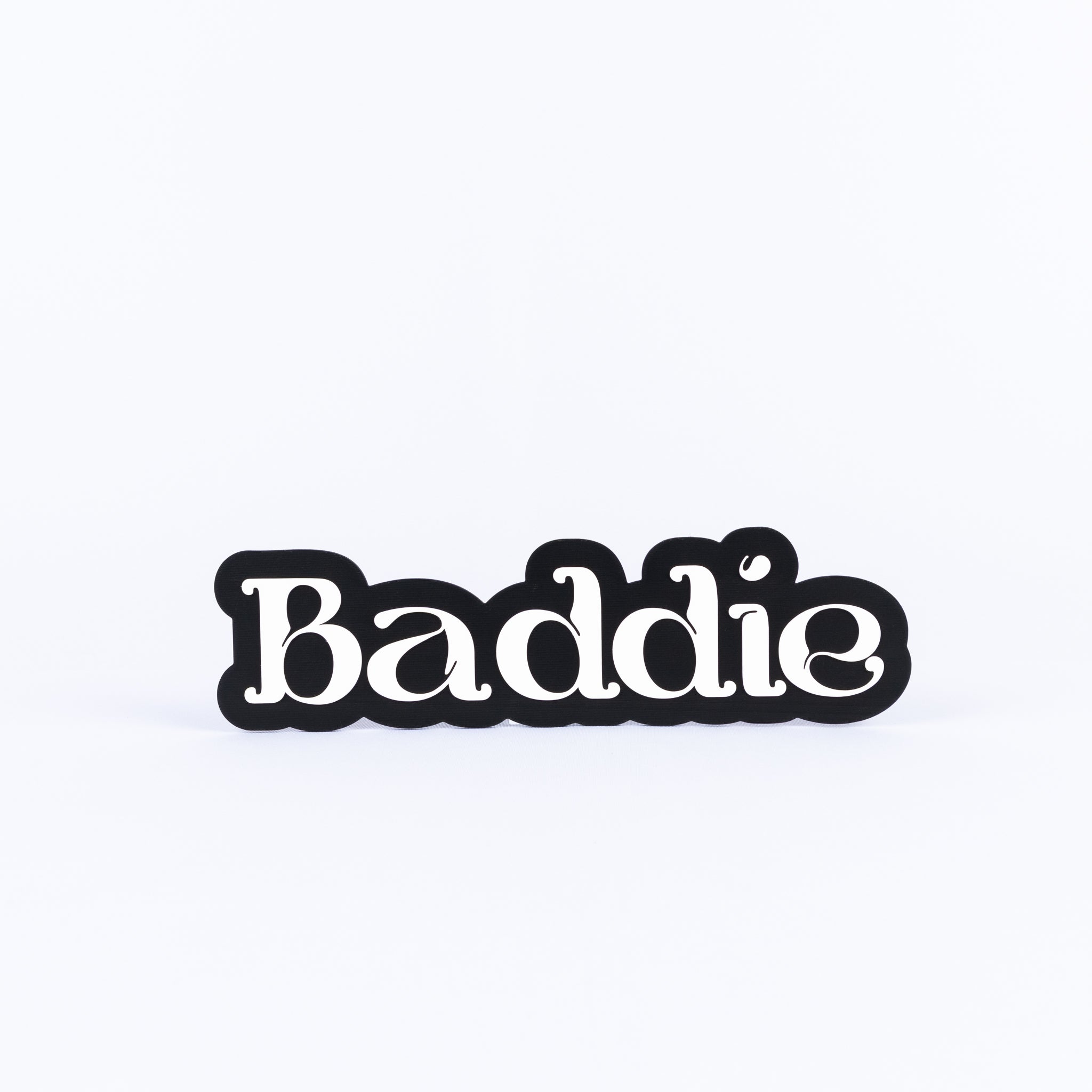 Black and white sign with 'Baddie' text on a white background