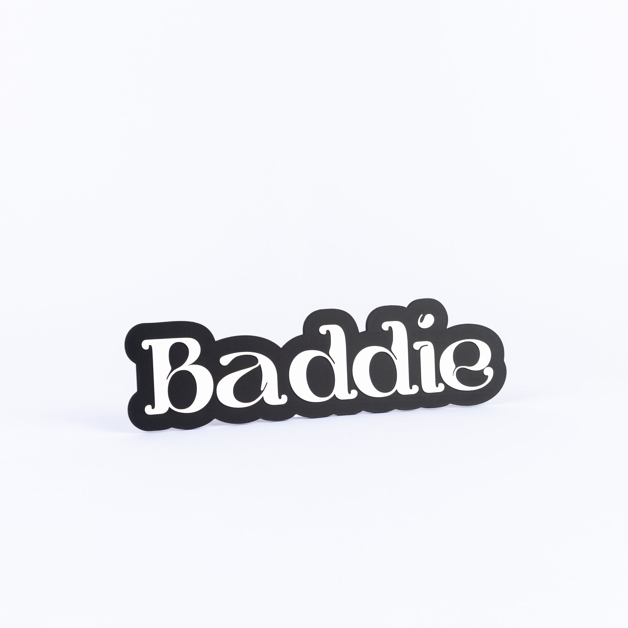 Black and white photo booth prop sign that says "baddie"