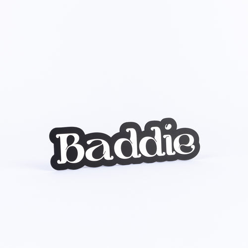 Black and white photo booth prop sign that says "baddie"