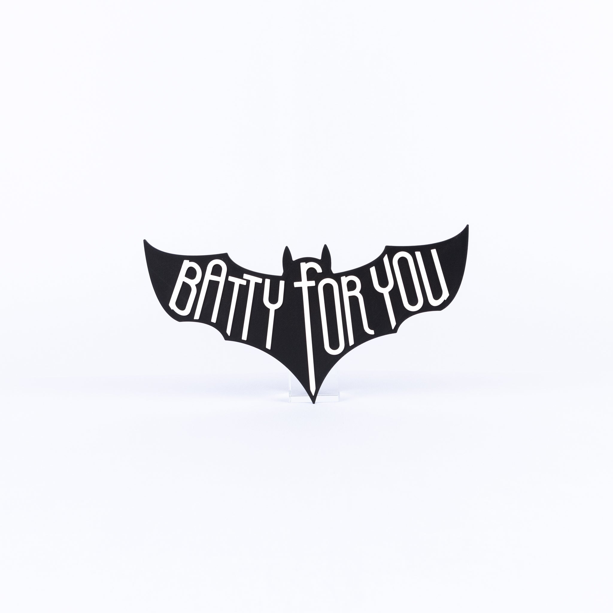 Black bat-shaped sign with 'Batty For You' white text on a white background