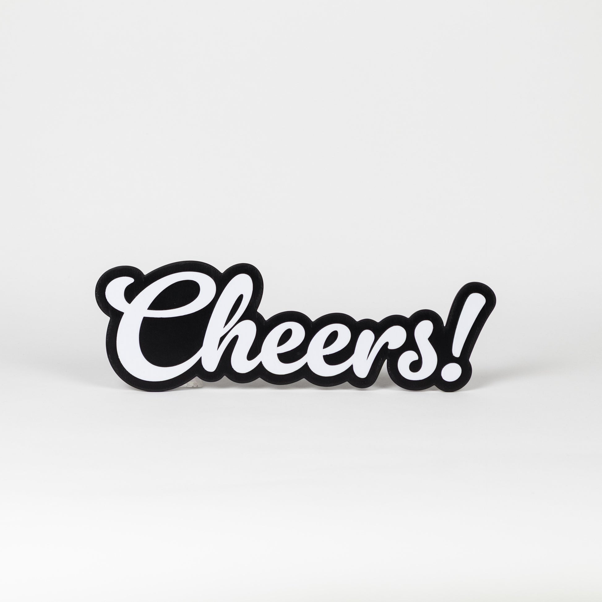 Black and white 'Cheers!' sign on a light gray background
