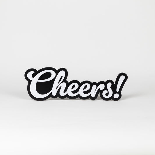 Black and white 'Cheers!' sign on a light gray background