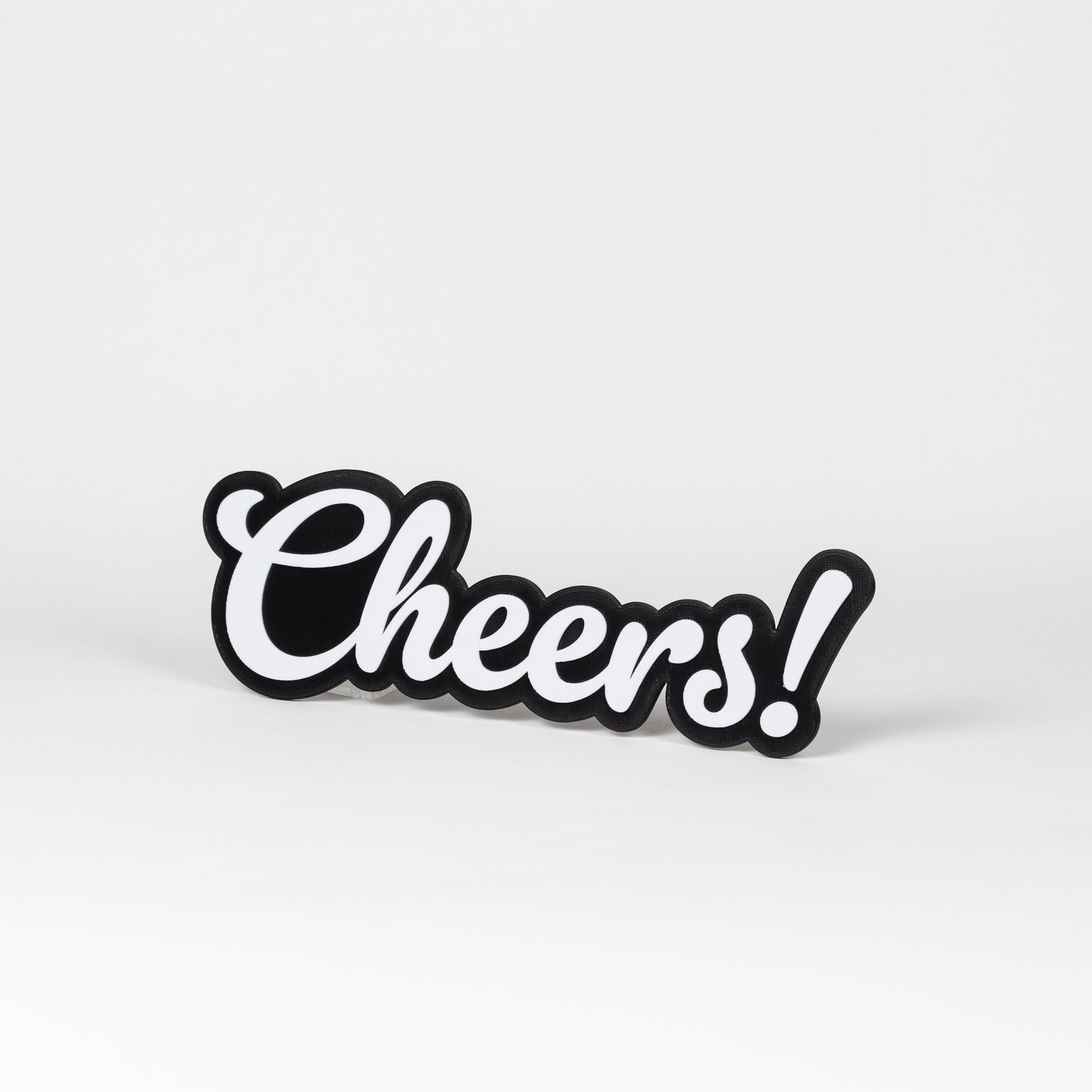 Black and white photo booth sign with 'Cheers!' text on a white background