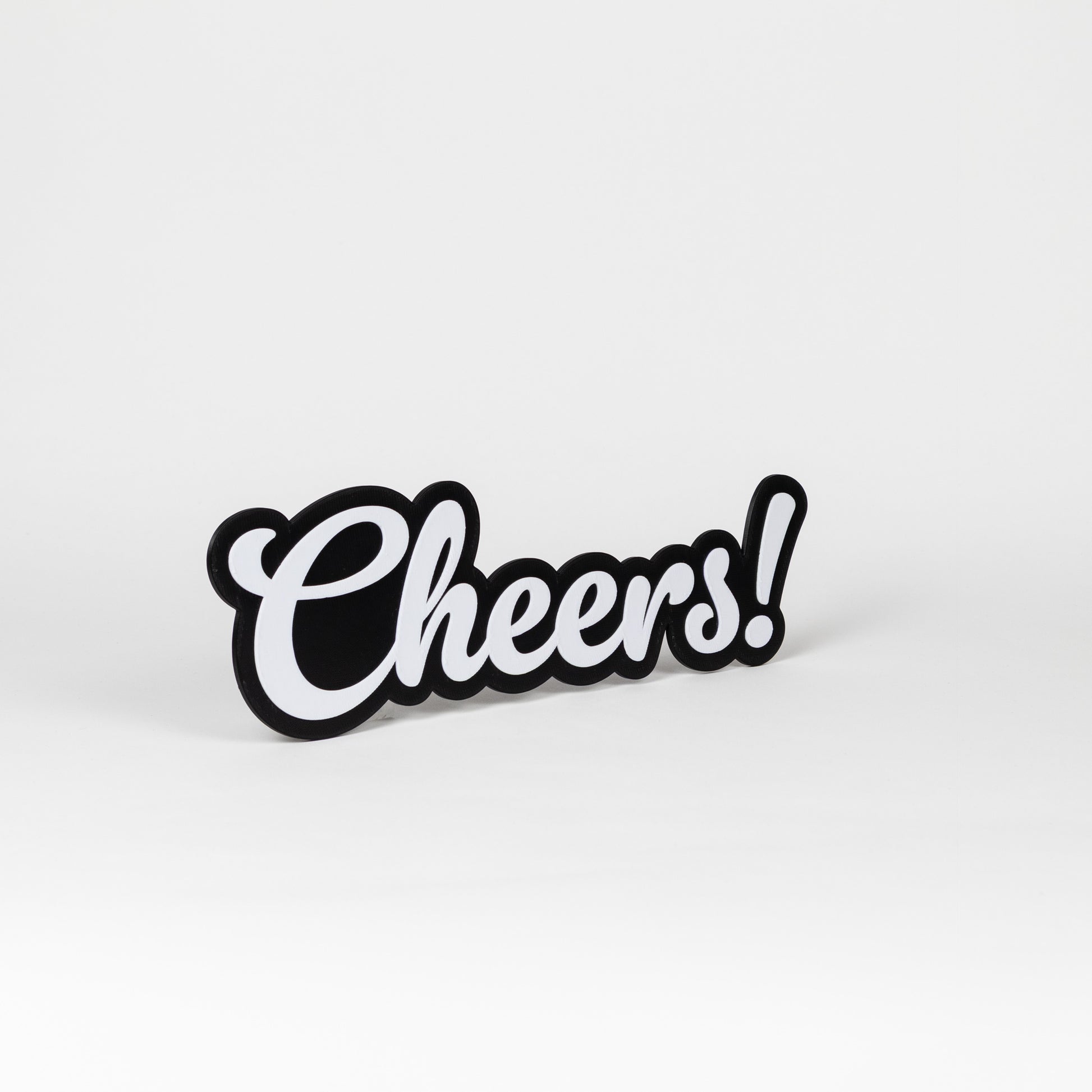 Black and white 'Cheers!' sign on a white background