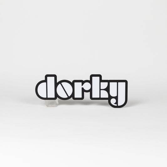 Photo booth prop sign. Black and white 'dorky' word art on a white background.