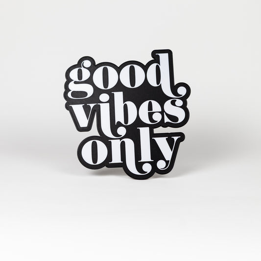 Photo booth sign with 'good vibes only' white text on a black base. Shot on a white background