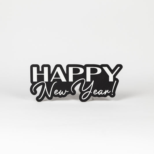 Photo booth prop sign with 'Happy New Year!' text on a black base. Shot on a white background