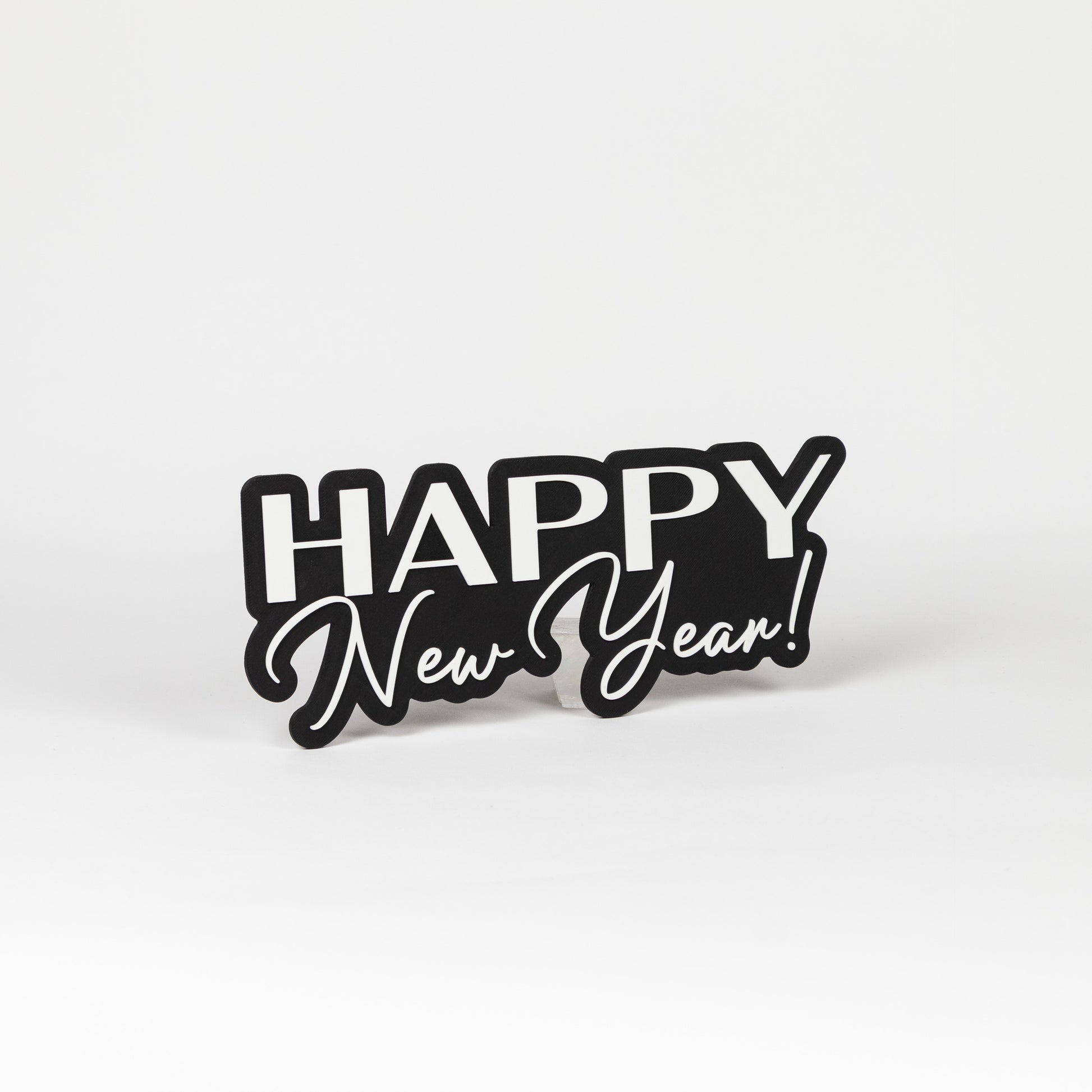 Photo booth sign with 'Happy New Year!' text shot on a white background