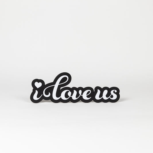 Photo Booth sign with 'i love us' text on a white background