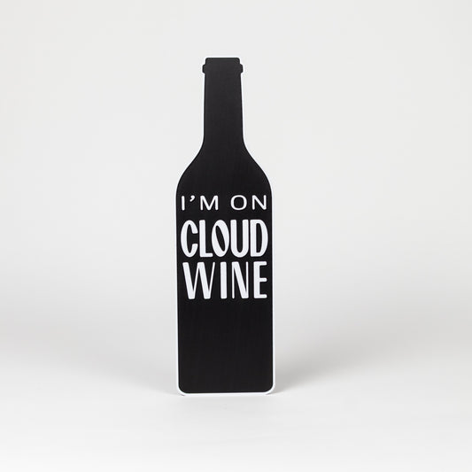 Black wine bottle-shaped sign with 'I'm on Cloud Wine' text on a white background
