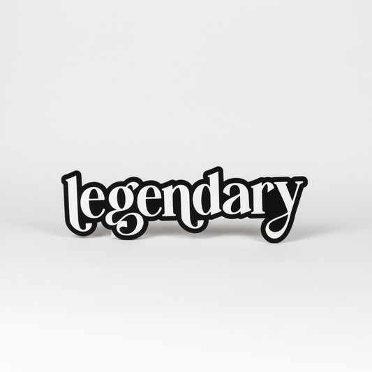 Photo booth prop sign. Black base with white 'legendary' text on a white background
