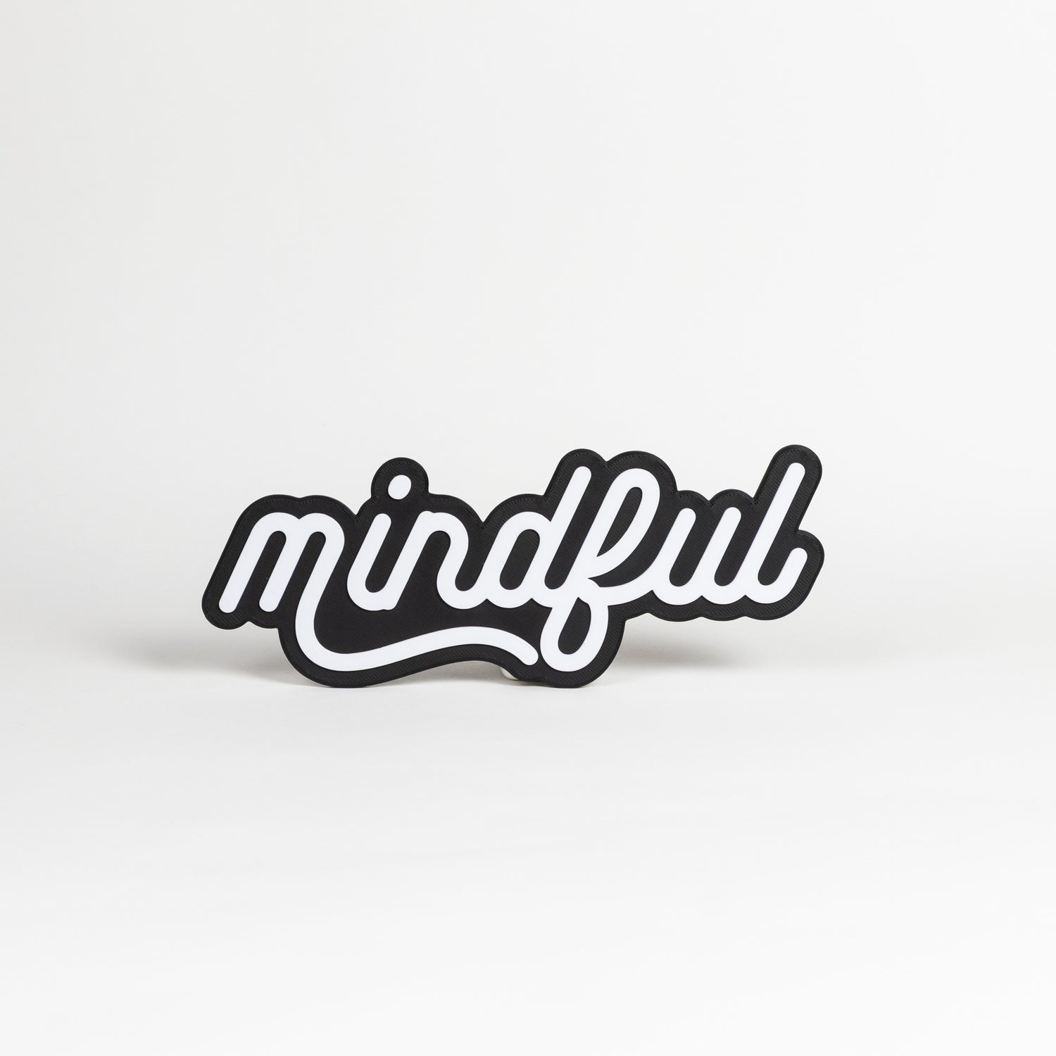 Black and white 'mindful' photo booth prop on a white background