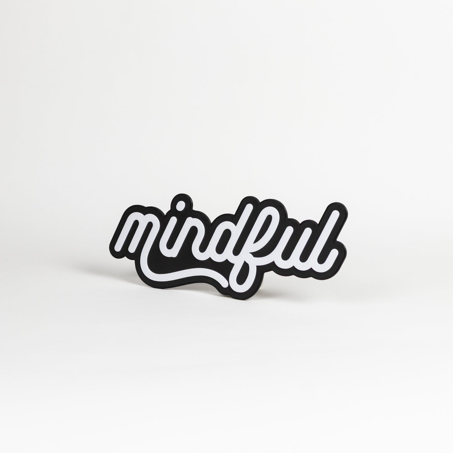 Black and white 'mindful' photo booth prop on a white background