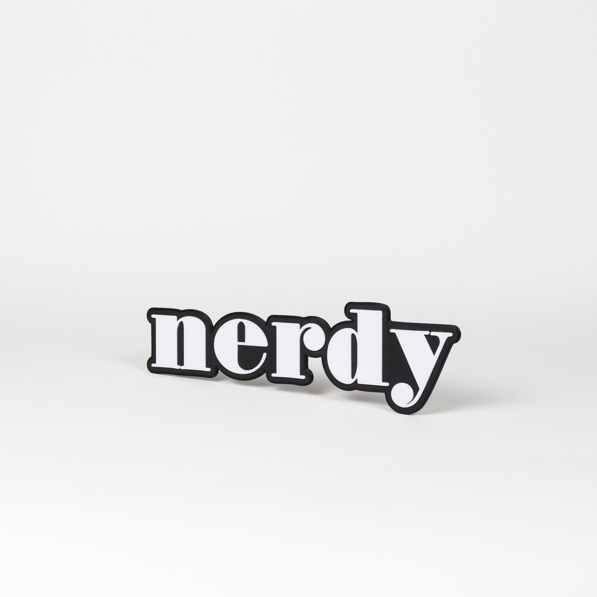 Black and white photo booth prop of the word 'nerdy'