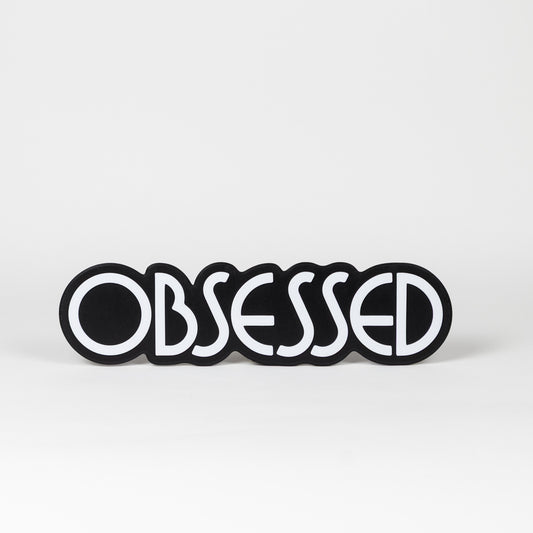 Black and white "Obsessed" sign. Photo booth prop.