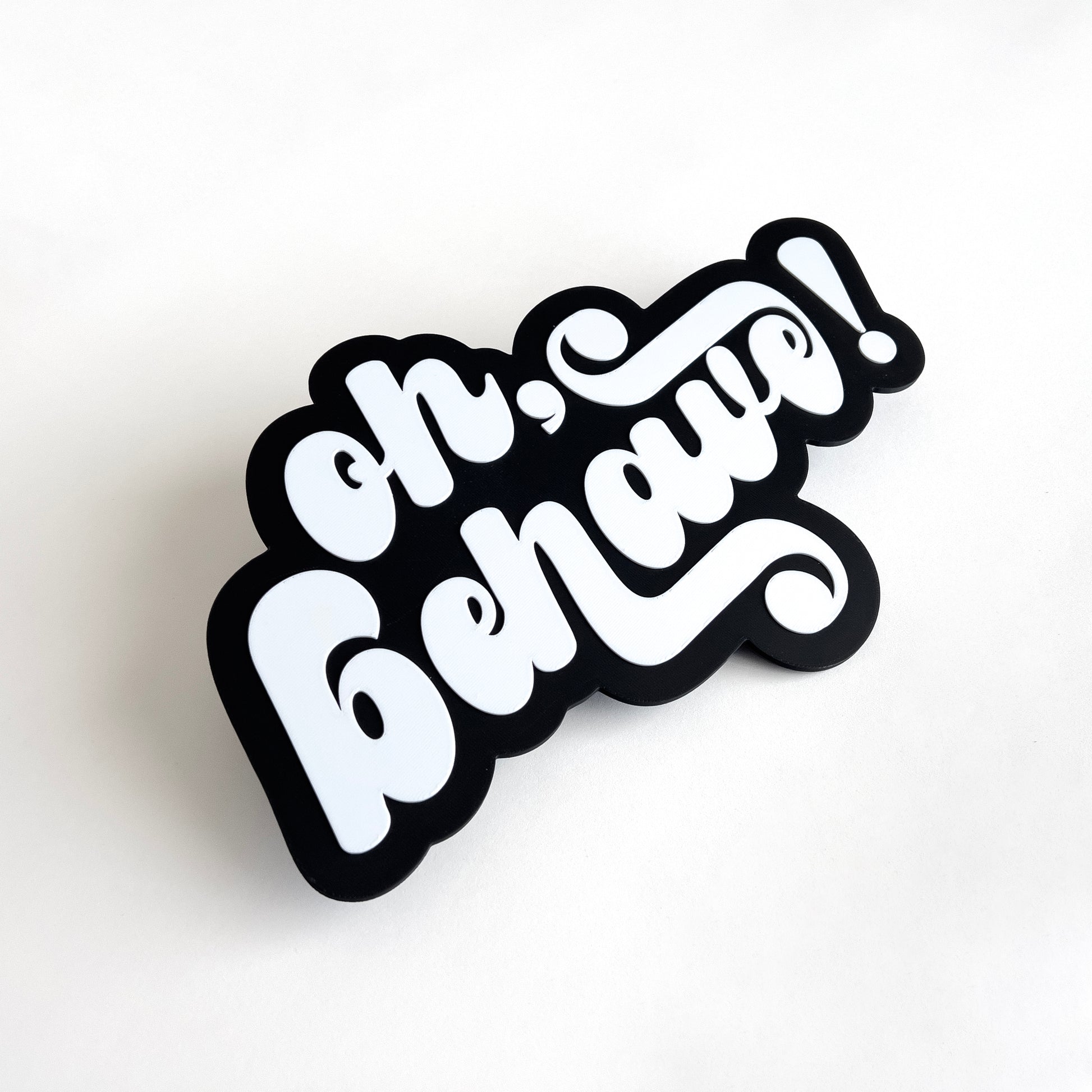 Black and white photo booth prop sign that says "oh, behave!".
