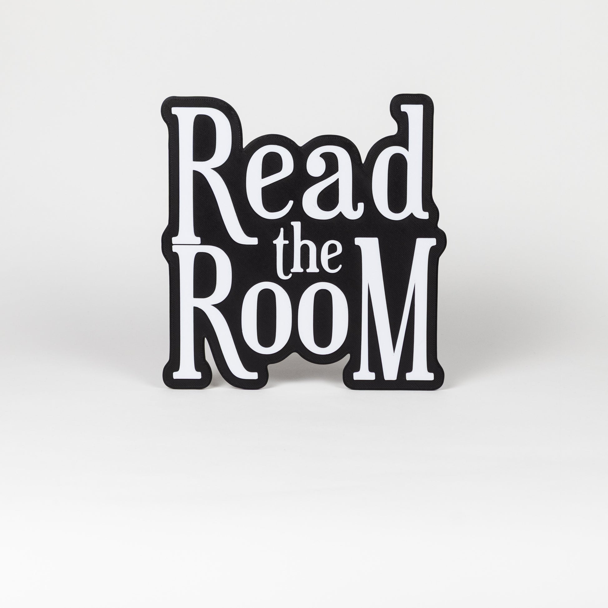 Black and white "Read the Room" sign. Photo booth prop.