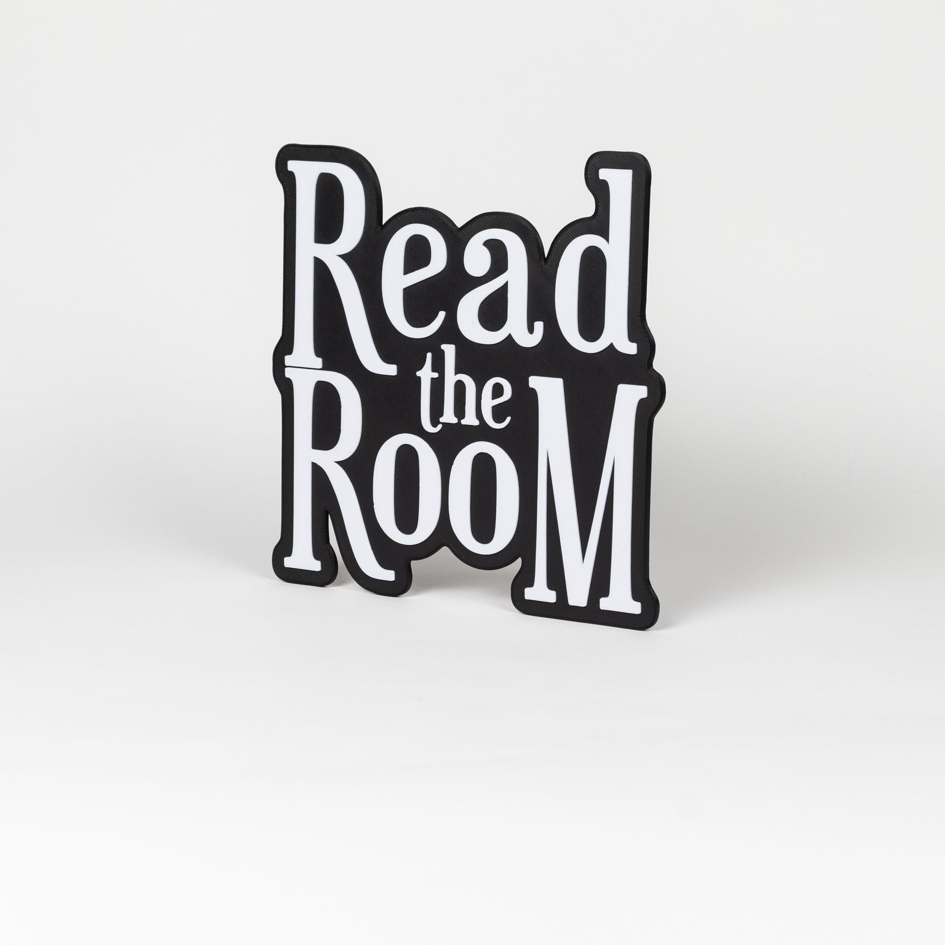 Black and white "Read the Room" sign. Photo booth prop.