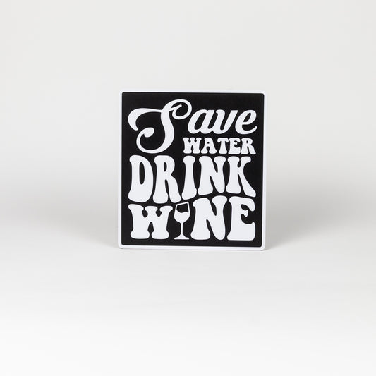 Black and white sign that says, "Save Water, Drink Wine". Photo booth prop.