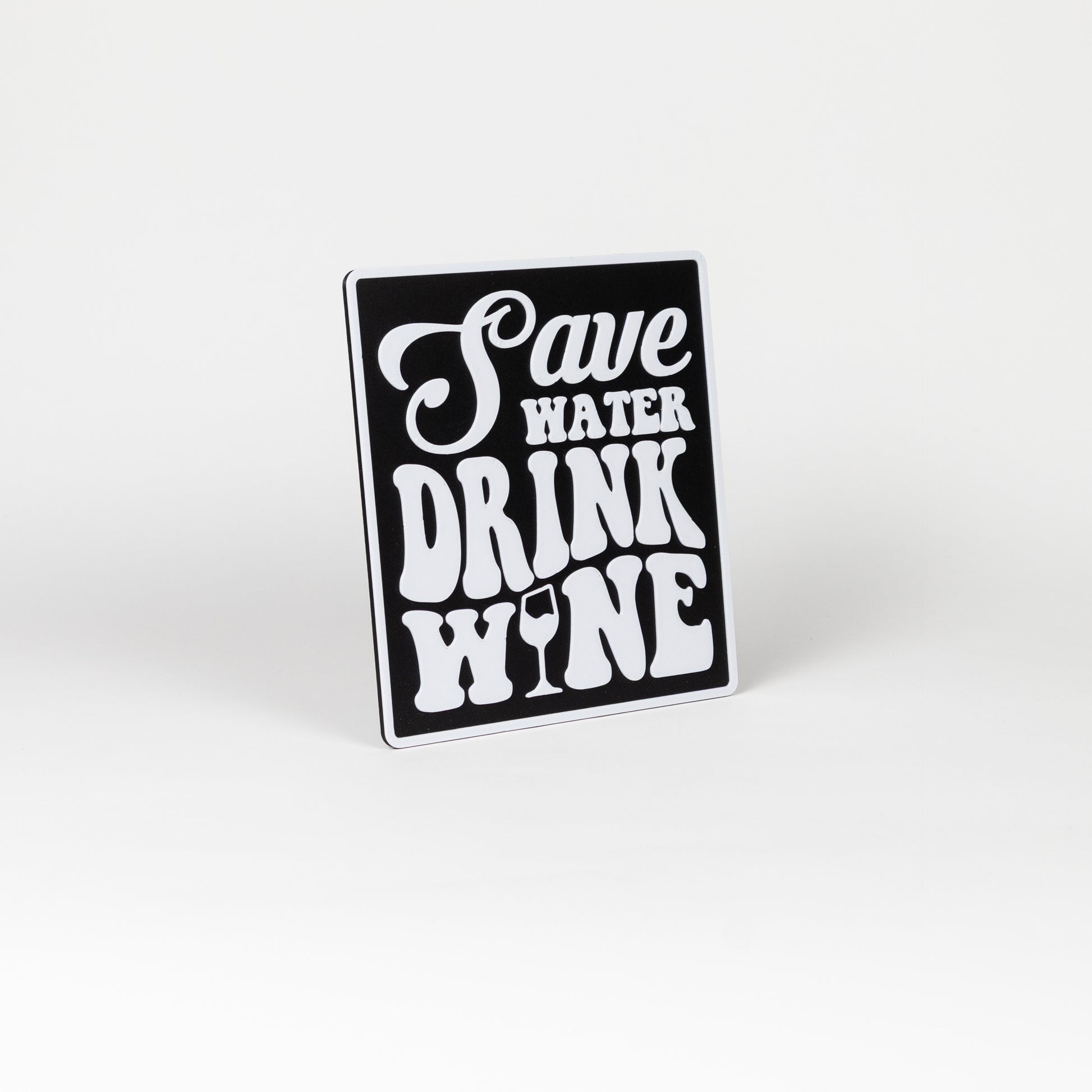 Black and white sign that says, "Save Water, Drink Wine". Photo booth prop.