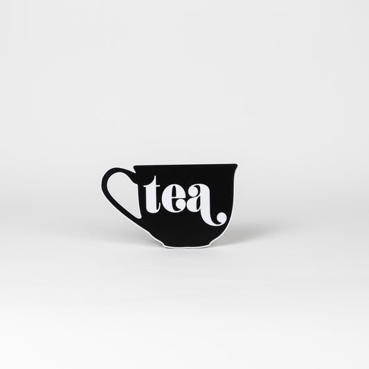 Black and white sign in the shape of a tea cup that says, "tea". Photo booth prop.