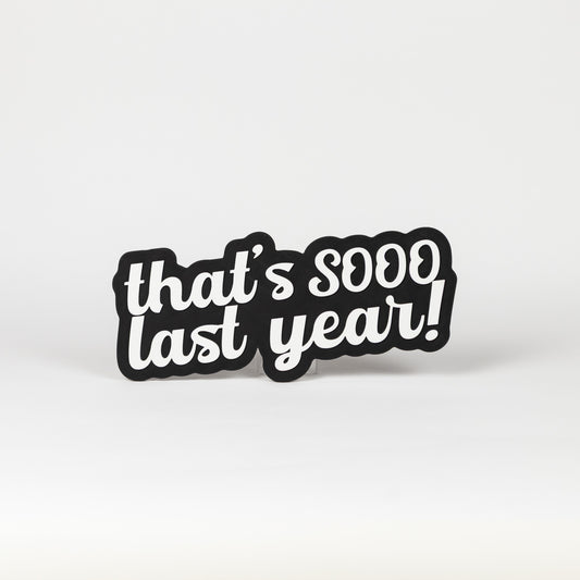 Black and white sign that says, "That's Sooo Last Year!". NYE photo party prop.
